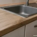 Що робити, якщо стільниця розбухла біля мийки